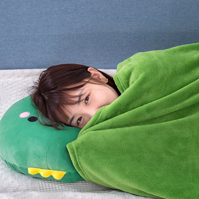 Close up shot of actress using blanket provided inside soft toy and using soft toy as a pillow