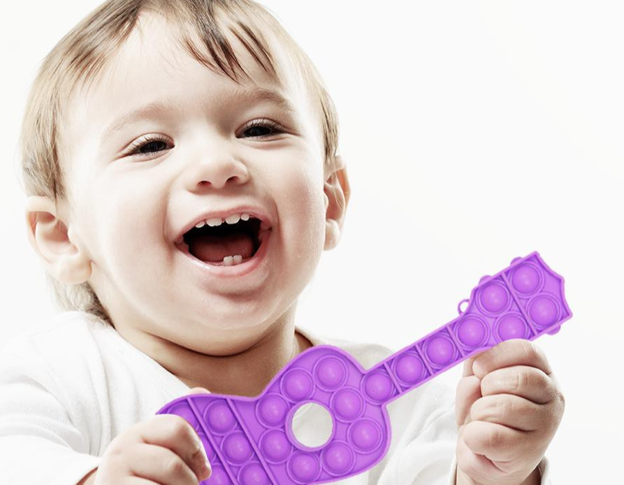 Guitar shape toy great for kids who want to pretend that they are playing guitar